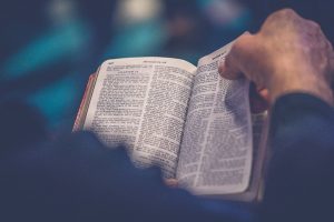 man-opening-bible