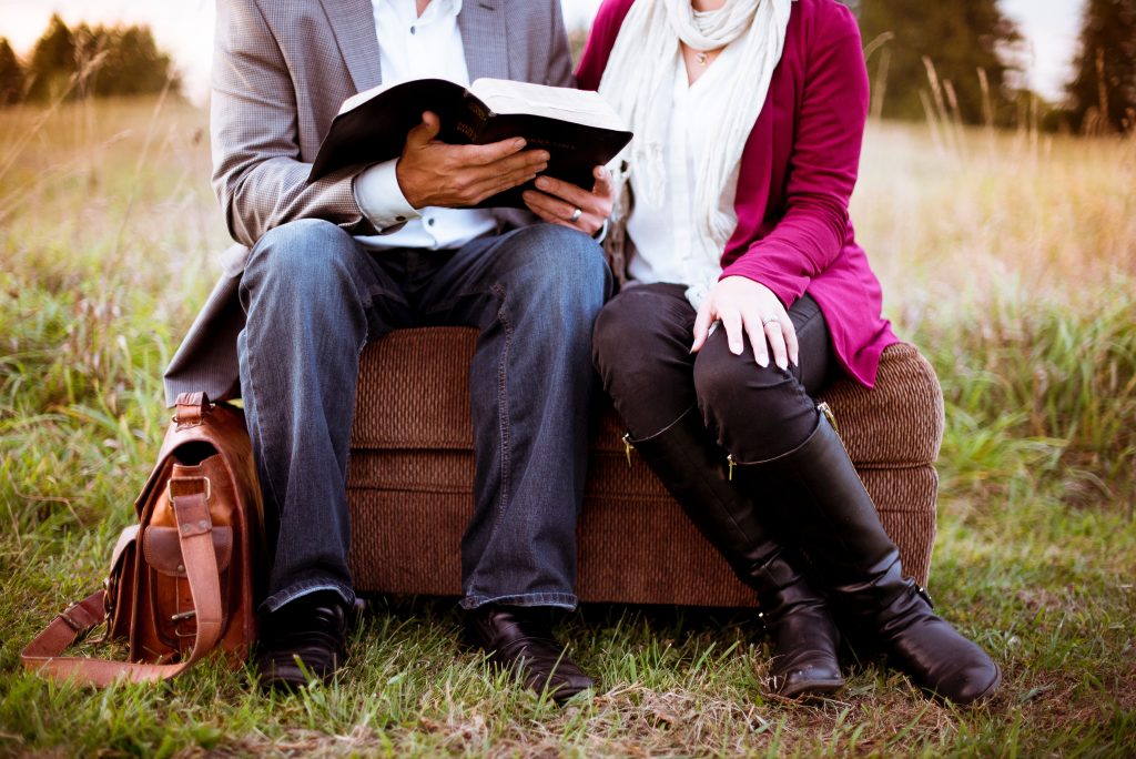 married-couple-reading-the-bible-together-praying-together