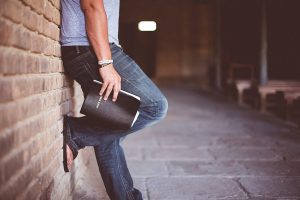 man-standing-with-bible